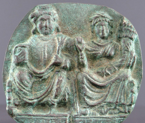 Gandhara, I-III secolo, grande placca di bronzo decorata in rilievo con Panchika e Hariti.