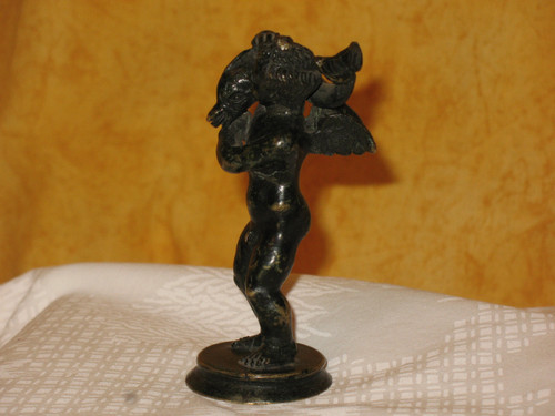 Bronze sculpture of the cherub and the dolphin in the Grand Tour style from the 20th century.