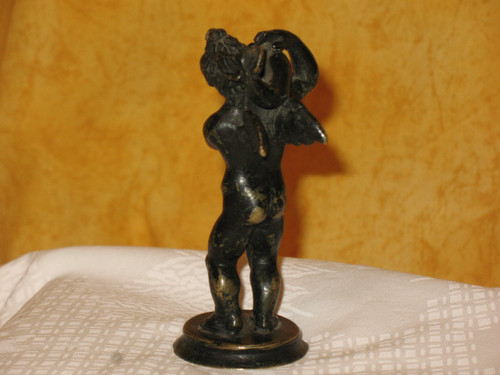 Bronze sculpture of the cherub and the dolphin in the Grand Tour style from the 20th century.