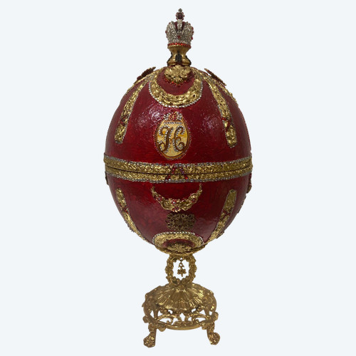 Egg-shaped jewelry box in boiled cardboard decorated with garlands, figures, double-headed eagles