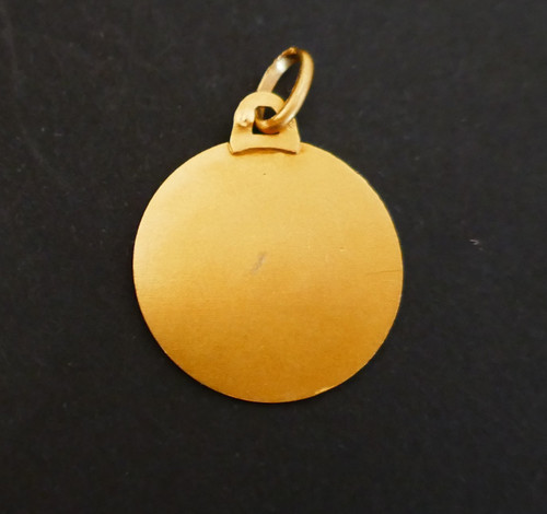 Jungfrauenmedaille aus 18 Karat Gold.