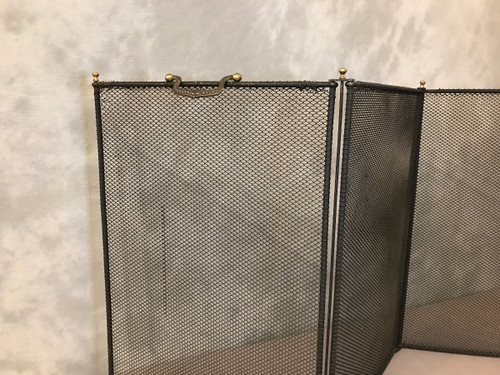 Old fireplace screen in blackened iron from the 19th century