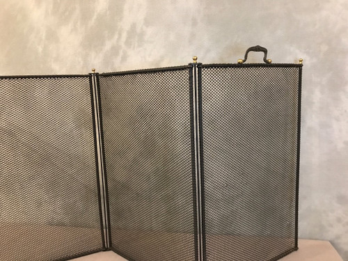 Old fireplace screen in blackened iron from the 19th century