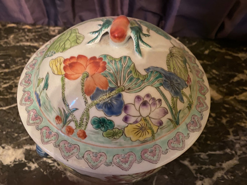 Ornamental Chinese porcelain ginger pot decorated with Lotus flowers, foliage and birds.