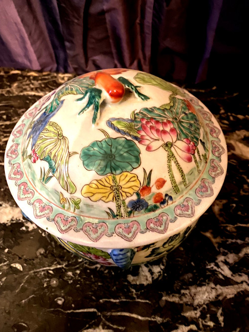 Ornamental Chinese porcelain ginger pot decorated with Lotus flowers, foliage and birds.