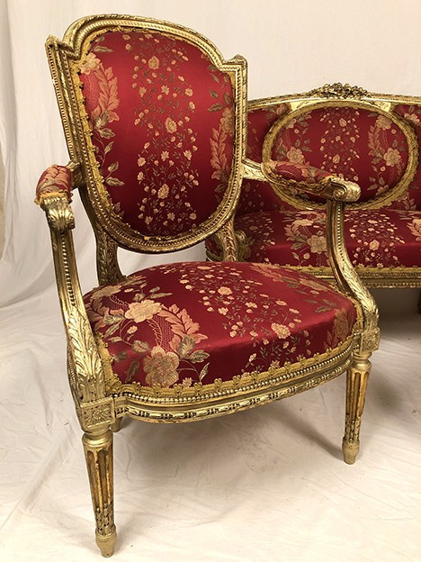 Louis XVI style living room set in gilded wood. Basket sofa and pair of armchairs