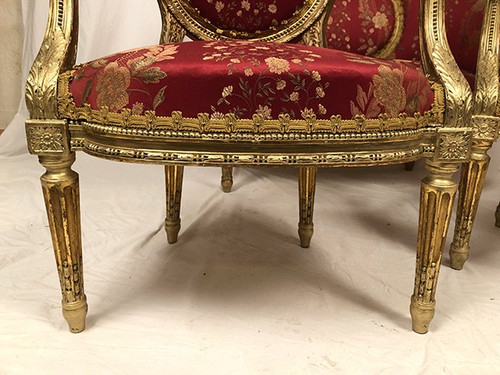 Louis XVI style living room set in gilded wood. Basket sofa and pair of armchairs