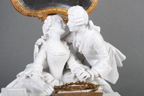 A romantic group in biscuit mounted lamp late 19th century