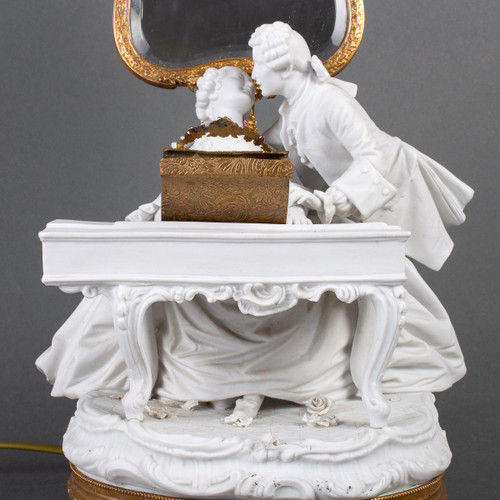 A romantic group in biscuit mounted lamp late 19th century