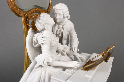 A romantic group in biscuit mounted lamp late 19th century