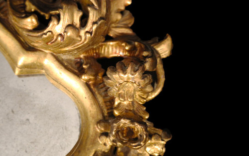  18th century Italian baroque mirror, gilded wood leaf