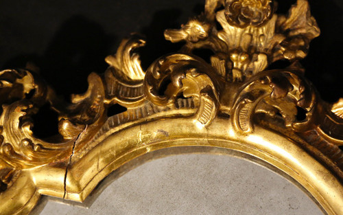  18th century Italian baroque mirror, gilded wood leaf