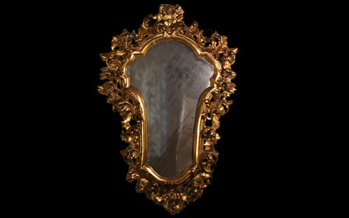  18th century Italian baroque mirror, gilded wood leaf