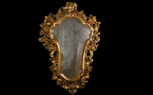  18th century Italian baroque mirror, gilded wood leaf