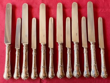 18 table knives and 18 cheese knives.