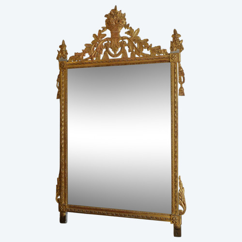 Louis XVI period mirror in gilded wood