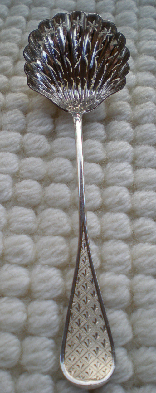 Napoleon III 19th century sprinkling spoon in solid silver, neck brace hallmark