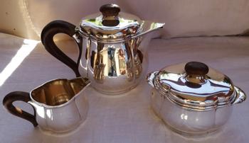 Art deco tea service in solid silver, punch neck brace Goldsmith Fouquet-Lapar