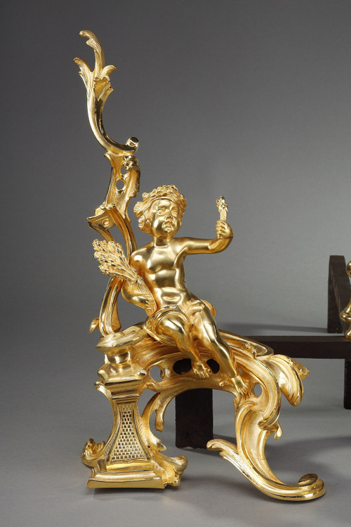 PAIR OF GILDED ANDIRONS IN THE LOUIS XV STYLE BRONZE