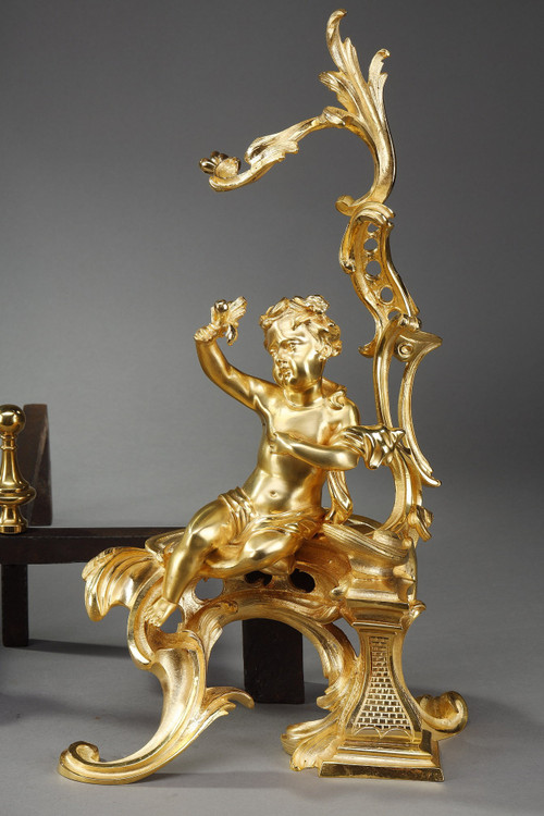 PAIR OF GILDED ANDIRONS IN THE LOUIS XV STYLE BRONZE