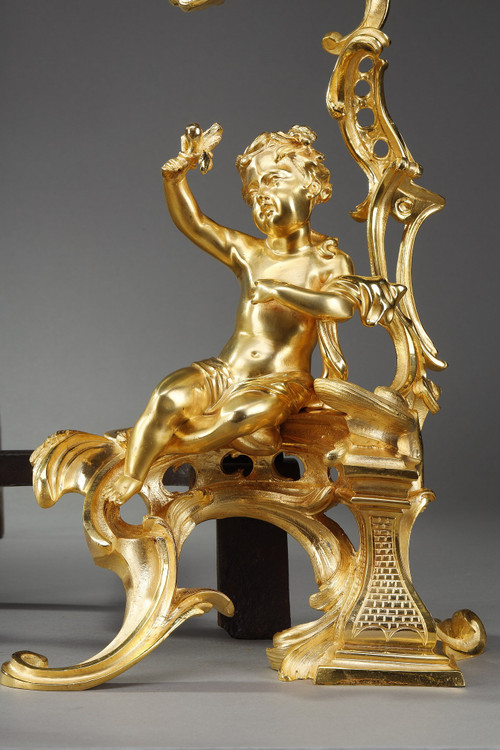 PAIR OF GILDED ANDIRONS IN THE LOUIS XV STYLE BRONZE