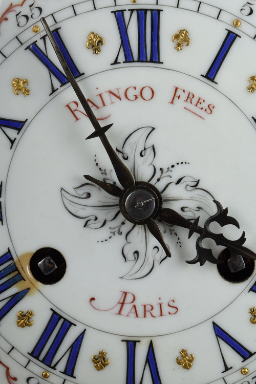 ORMOLU AND CHASED BRONZE ROCAILLE CLOCK, RAINGO AND BROTHERS 