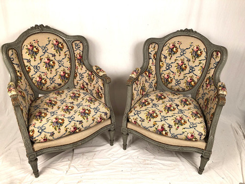 Pair of Louis XVI style wing chairs in gray lacquered wood. Late 19th century