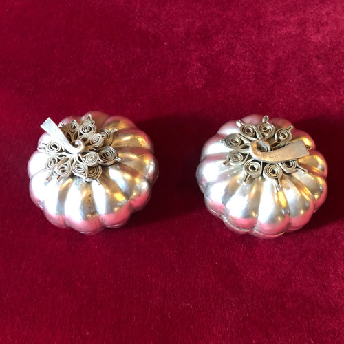 Two foreign silver pumpkins