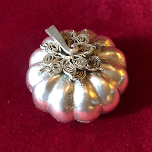 Two foreign silver pumpkins