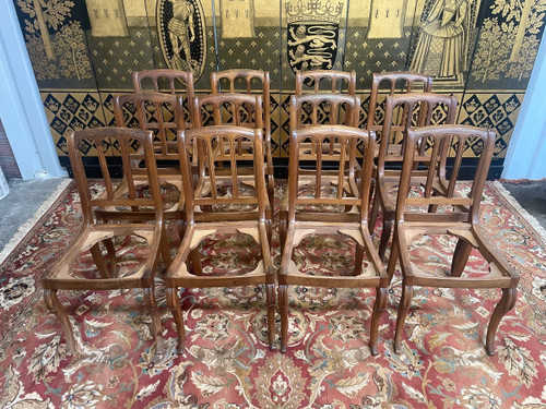 Suite Of 12 Restaurarion Style Chairs With “Cathedral” Backs