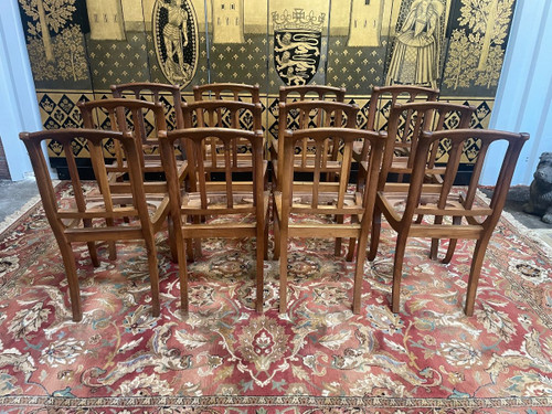 Suite Of 12 Restaurarion Style Chairs With “Cathedral” Backs