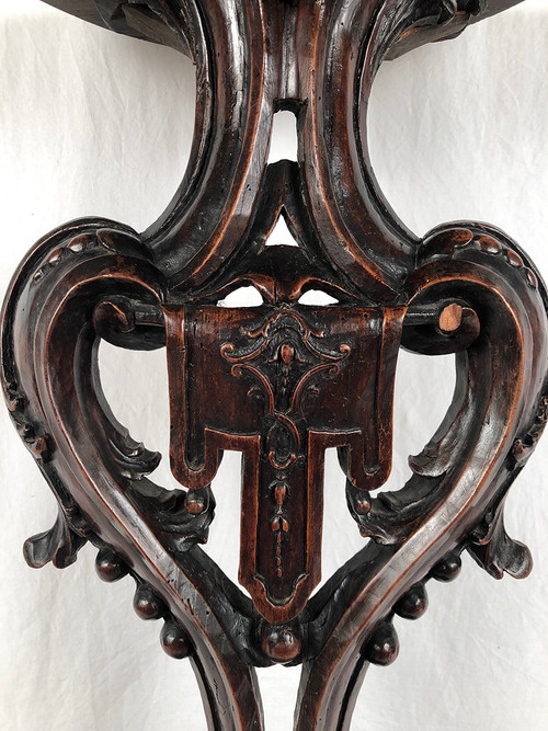 Richly carved walnut sellette, 18th century