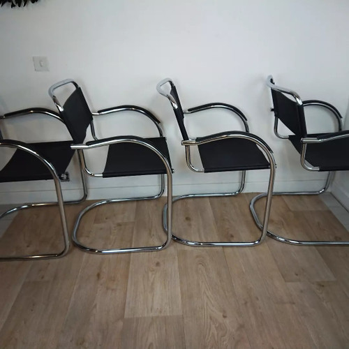 Cantilever tubular steel chairs and armchairs