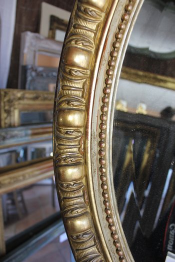 Antique Napoleon III oval mirror in gilded Louis XV style