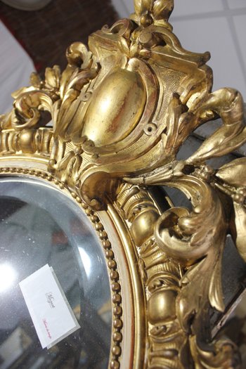 Antique Napoleon III oval mirror in gilded Louis XV style