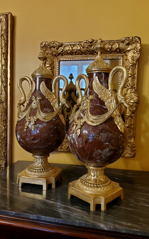 Pair of Red Marble Vases with gilded bronzes and swans in the Louis XVI style, late 19th century.