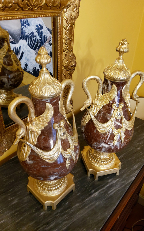 Pair of Red Marble Vases with gilded bronzes and swans in the Louis XVI style, late 19th century.