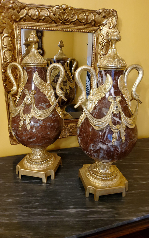 Pair of Red Marble Vases with gilded bronzes and swans in the Louis XVI style, late 19th century.