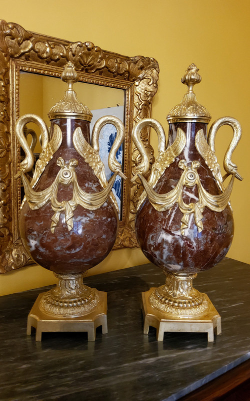 Pair of Red Marble Vases with gilded bronzes and swans in the Louis XVI style, late 19th century.