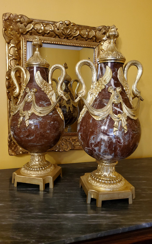 Pair of Red Marble Vases with gilded bronzes and swans in the Louis XVI style, late 19th century.