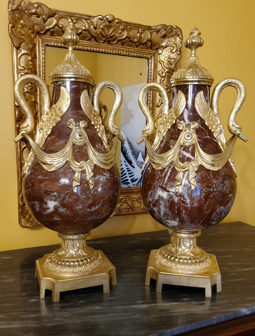 Pair of Red Marble Vases with gilded bronzes and swans in the Louis XVI style, late 19th century.