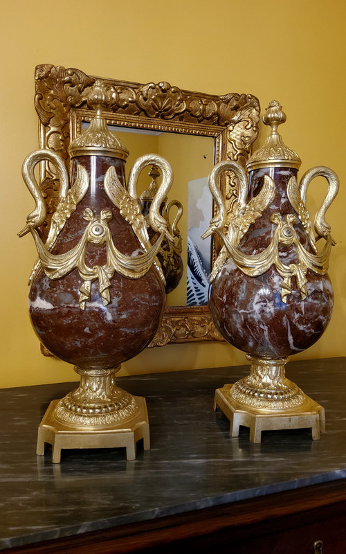 Pair of Red Marble Vases with gilded bronzes and swans in the Louis XVI style, late 19th century.