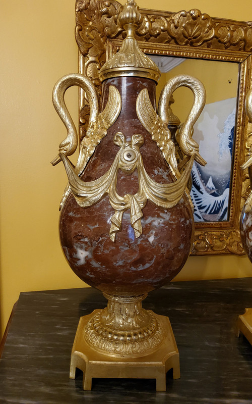 Pair of Red Marble Vases with gilded bronzes and swans in the Louis XVI style, late 19th century.