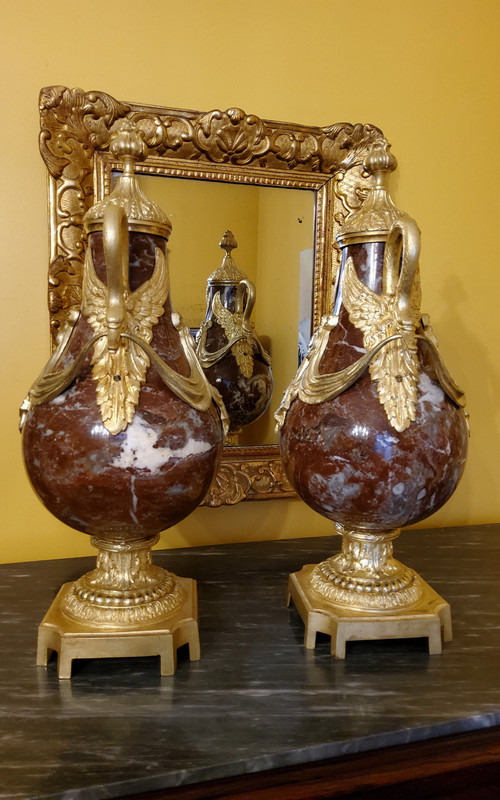 Pair of Red Marble Vases with gilded bronzes and swans in the Louis XVI style, late 19th century.