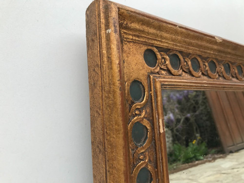 Rectangular mirror in gilded wood.