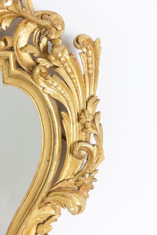 Regency style mirror in carved and gilded wood. 1950s.