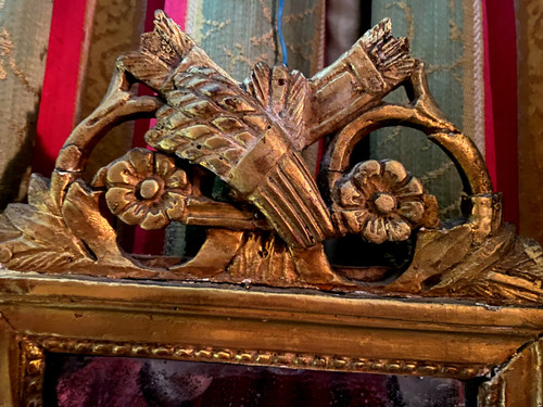 Charming Louis XVI gilded wood mirror with wheat sheaf and quiver, 18th century