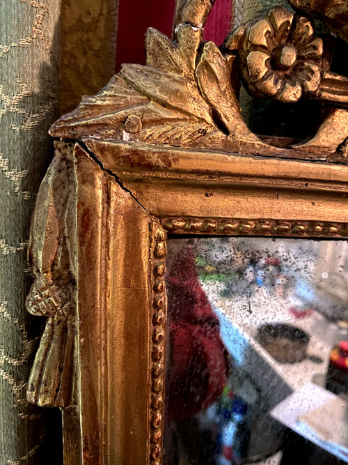 Charming Louis XVI gilded wood mirror with wheat sheaf and quiver, 18th century