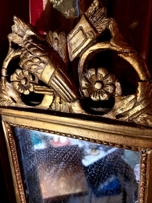 Charming Louis XVI gilded wood mirror with wheat sheaf and quiver, 18th century