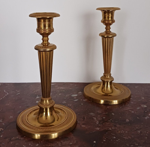 Paris, late 18th century - pair of small gilded bronze candlesticks or torches - late Louis XVI period